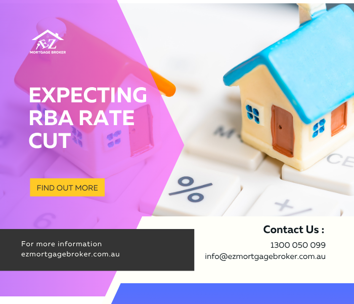A happy Australian mortgage holder smiling while looking at a graph on a laptop that shows interest rates falling.